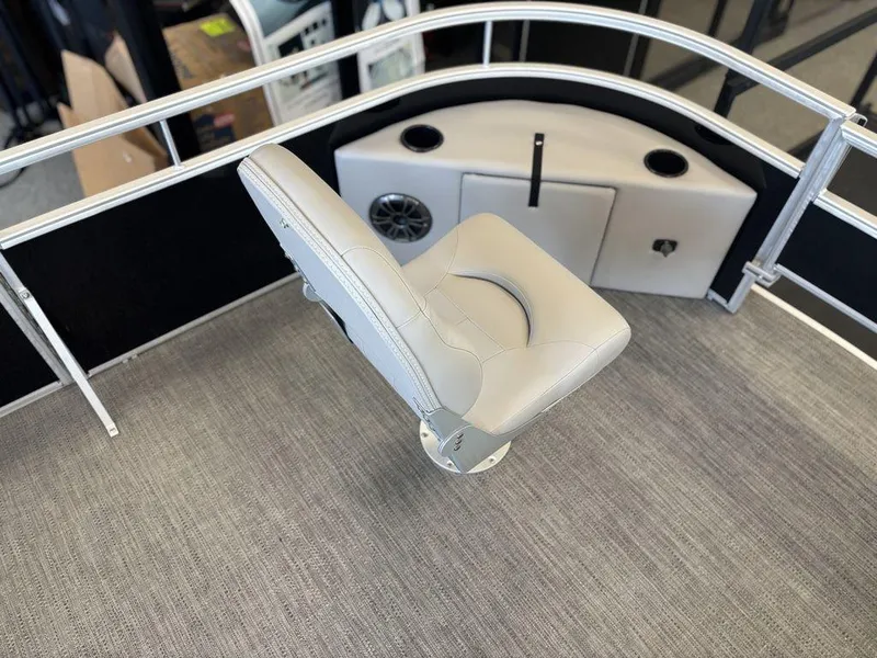 Slide: The Image of 2025 Godfrey Xperience 1886 FX boat interior with a swivel seat and speaker system. - 10
