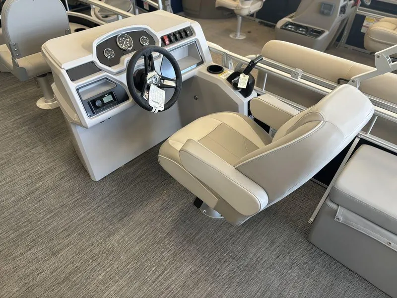 Slide: The Image of 2025 Godfrey Xperience 1886 FX boat interior with steering console and captain's chair. - 11