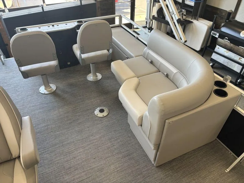 Slide: The Image of Interior of 2025 Godfrey Xperience 1886 FX boat with gray seating and modern design. - 12