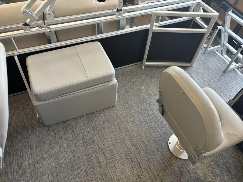 Slide: The Image of Interior of 2025 Godfrey Xperience 1886 FX boat with seating and carpeted flooring. - 14