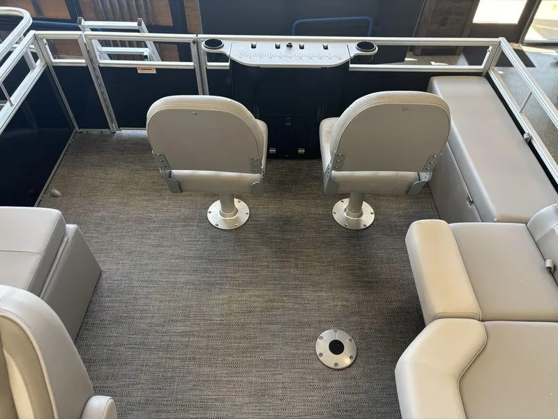 Slide: The Image of 2025 Godfrey Xperience 1886 FX boat interior with seating and console. - 16