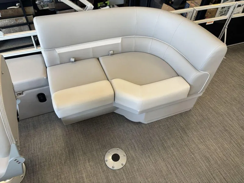 Slide: The Image of Luxurious seating on 2025 Godfrey Xperience 1886 FX boat, featuring sleek gray upholstery. - 19