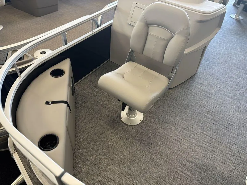 Slide: The Image of 2025 Godfrey Xperience 1886 FX boat interior with a swivel seat and cup holders. - 7