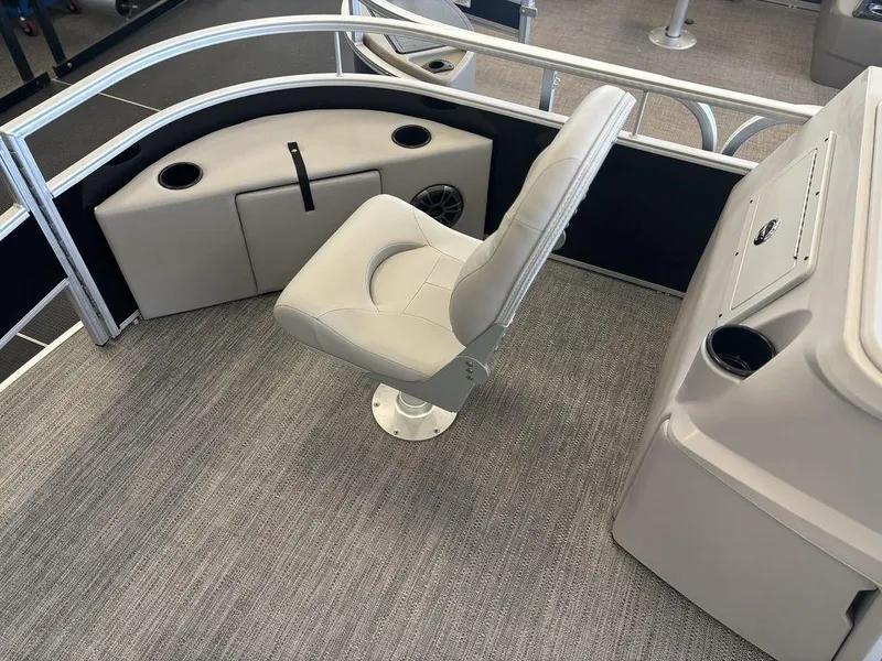Slide: The Image of 2025 Godfrey Xperience 1886 FX boat interior with captain's chair and console. - 8