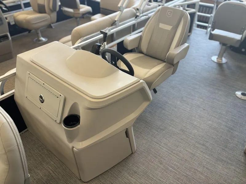 Slide: The Image of 2025 Godfrey Xperience 1886 FX boat interior with steering console and seating. - 9