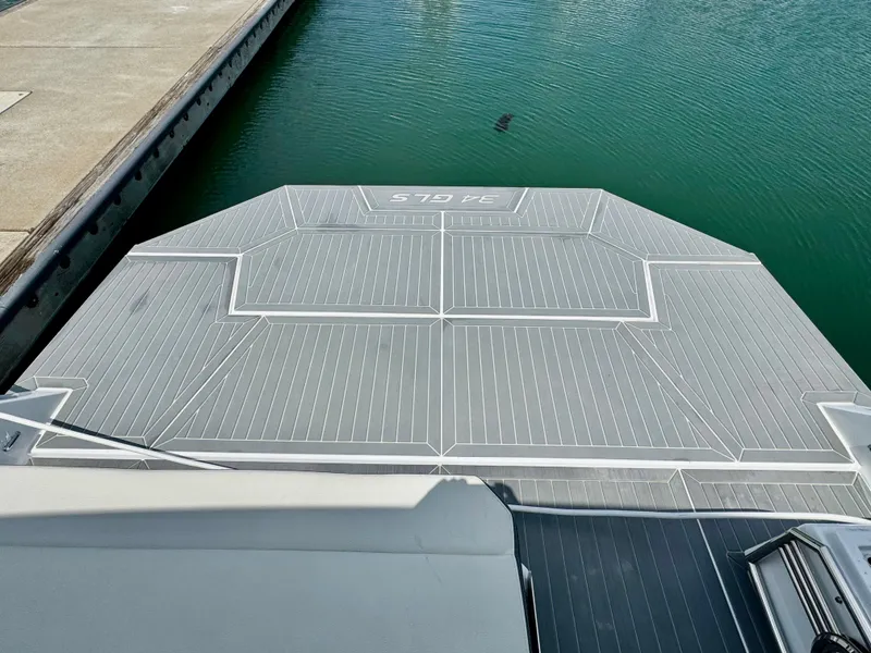 Slide: The Image of 2023 Cruisers Yachts 34 GLS I/O swim platform at marina dock. - 14