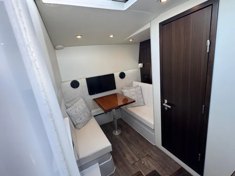 Slide: The Image of 2023 Cruisers Yachts 34 GLS I/O interior with cozy seating and modern decor. - 50