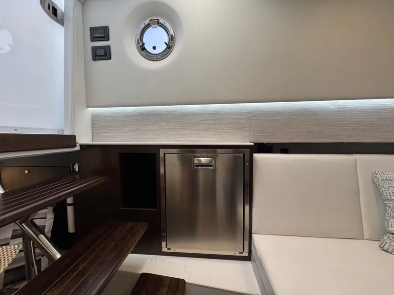 Slide: The Image of 2023 Cruisers Yachts 34 GLS I/O interior with modern seating and stainless steel accents. - 58