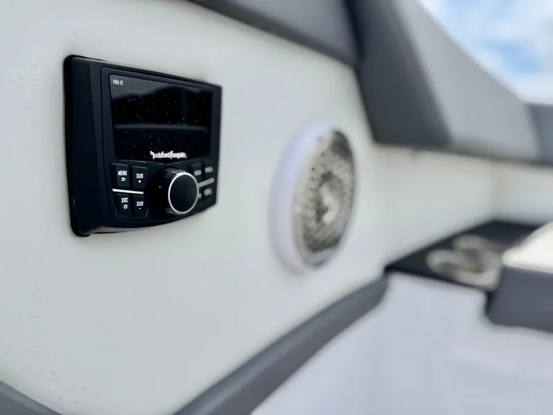 Slide: The Image of 2023 Cruisers Yachts 34 GLS I/O interior with audio system and speaker detail. - 35