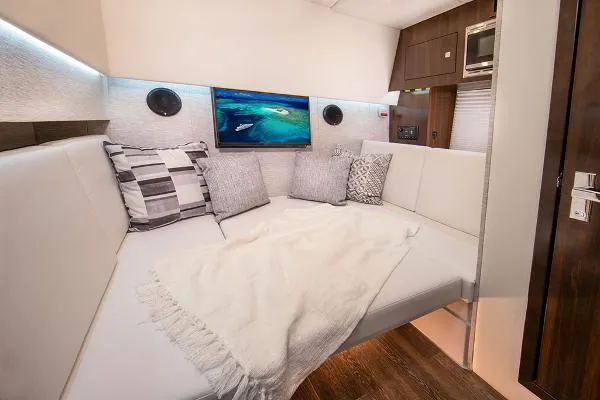 Slide: The Image of Luxurious interior of 2023 Cruisers Yachts 34 GLS I/O with cozy seating and modern decor. - 49