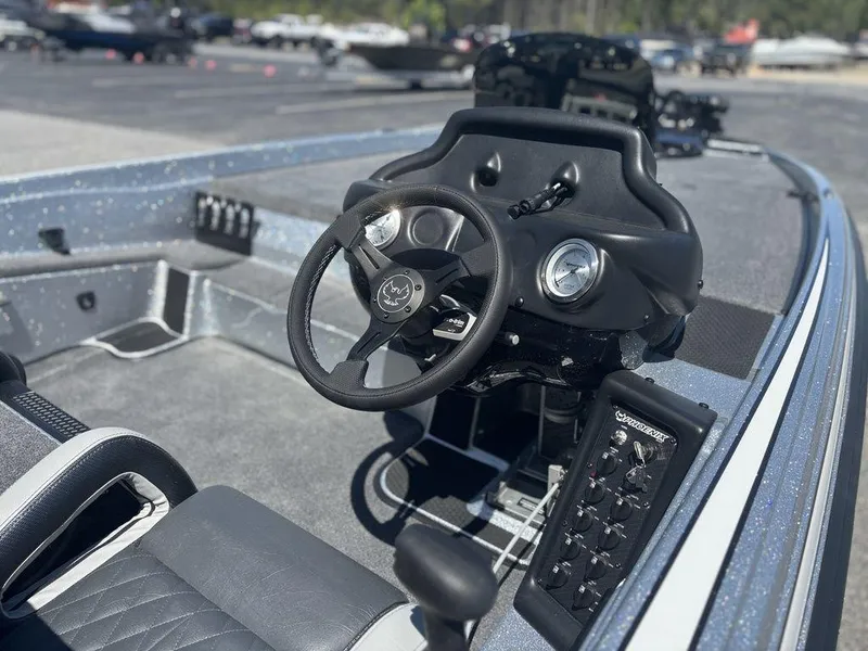 Slide: The Image of 2025 Phoenix 721 ZXL boat interior with steering wheel and control panel. - 10