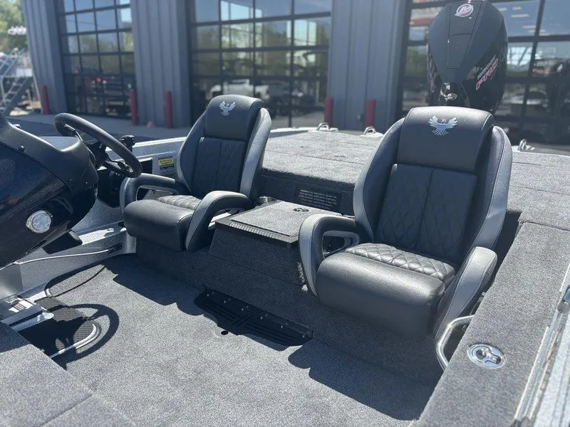 Slide: The Image of Interior of 2025 Phoenix 721 ZXL boat with two black seats and steering console. - 11