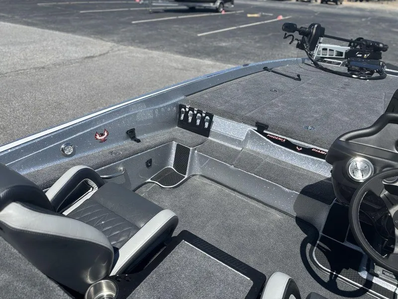 Slide: The Image of Interior of a 2025 Phoenix 721 ZXL boat with seating and steering wheel. - 15