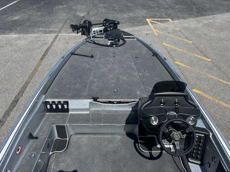 Slide: The Image of 2025 Phoenix 721 ZXL boat interior with steering console and spacious deck. - 16