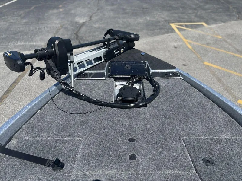 Slide: The Image of Bow of 2025 Phoenix 721 ZXL boat with trolling motor and carpeted deck. - 17