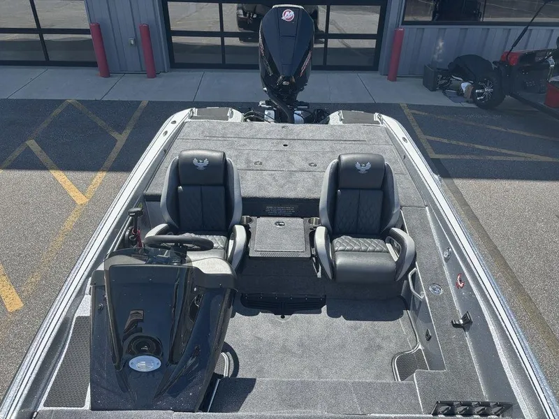Slide: The Image of 2025 Phoenix 721 ZXL boat interior with dual seats and steering console. - 18