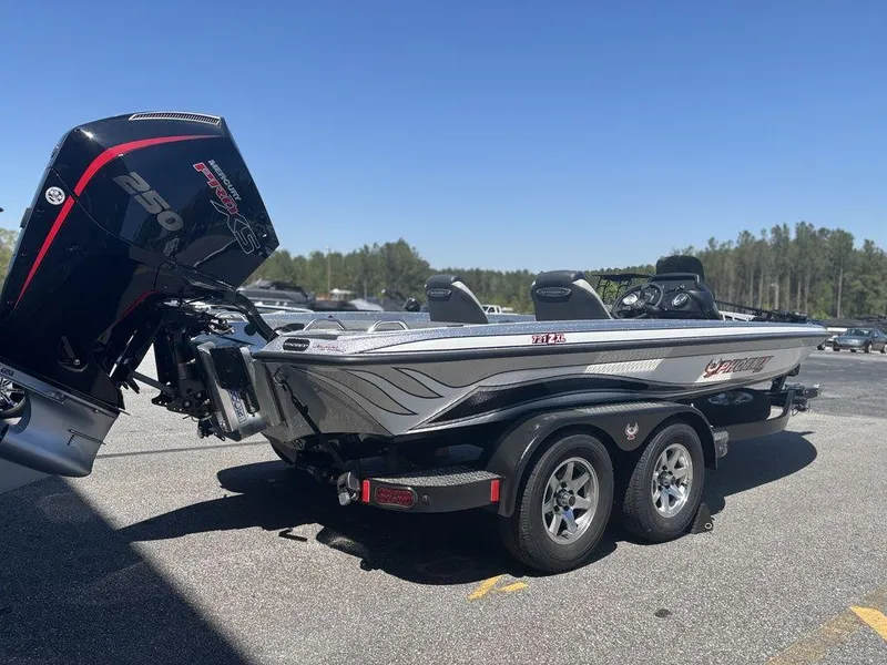 Slide: The Image of 2025 Phoenix 721 ZXL bass boat with powerful outboard motor, parked on a trailer. - 3