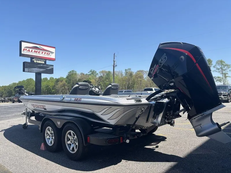 Slide: The Image of 2025 Phoenix 721 ZXL boat with powerful outboard motor in dealership lot. - 4