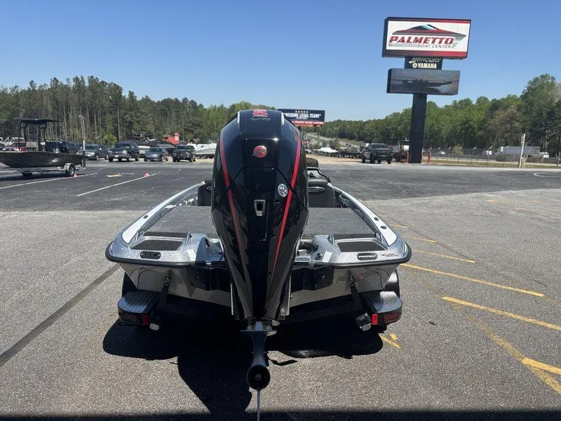Slide: The Image of 2025 Phoenix 721 ZXL boat with powerful outboard motor in dealership lot. - 5