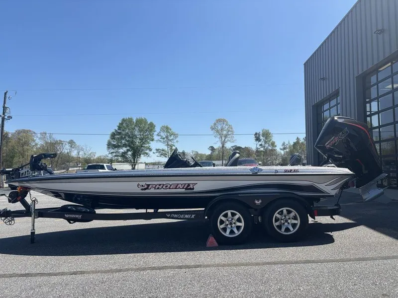 Slide: The Image of 2025 Phoenix 721 ZXL boat on trailer outside a building, sunny day. - 6