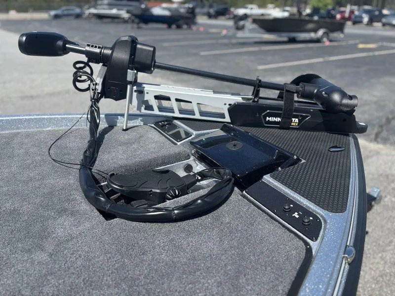 Slide: The Image of Phoenix 721 ZXL 2025 boat with Minn Kota trolling motor on deck. - 9