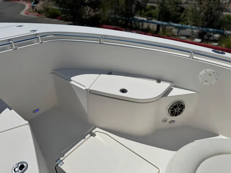 Slide: The Image of 2017 Cobia 237 Center Console boat interior with storage and speaker. - 15