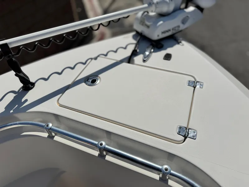 Slide: The Image of 2017 Cobia 237 Center Console boat deck with hatch and railing. - 17