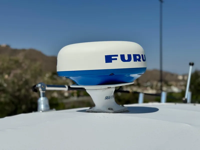 Slide: The Image of Radar dome on 2017 Cobia 237 Center Console boat, clear sky background. - 21