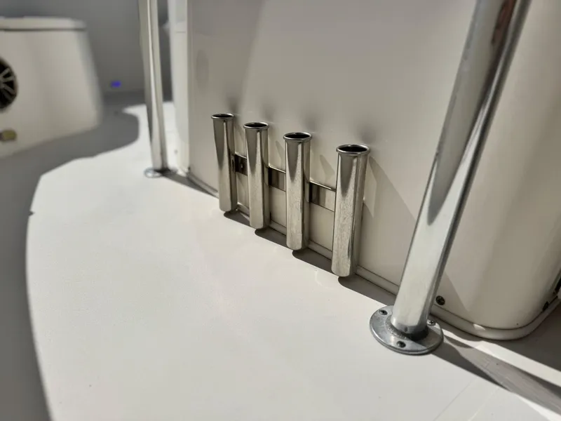 Slide: The Image of 2017 Cobia 237 Center Console boat with stainless steel rod holders. - 25