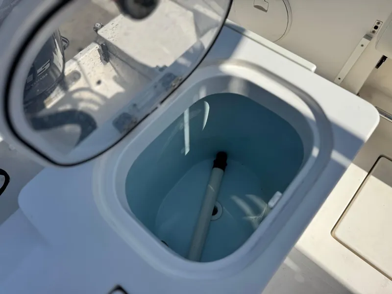 Slide: The Image of Livewell compartment on a 2017 Cobia 237 Center Console boat. - 30