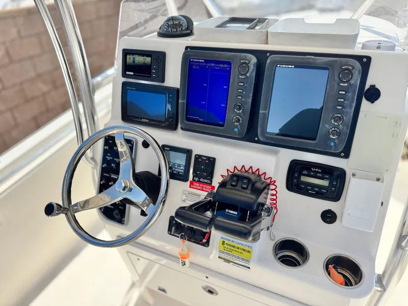 Slide: The Image of 2017 Cobia 237 Center Console dashboard with navigation and control systems. - 40