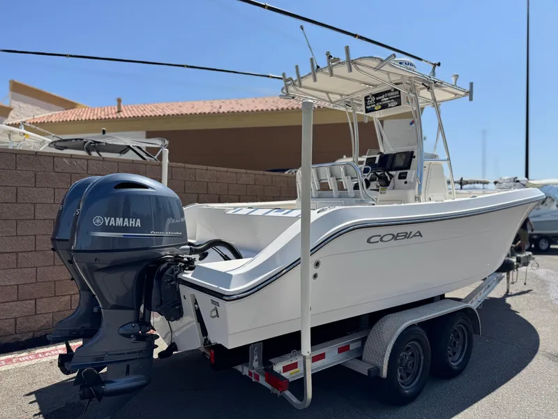 Slide: The Image of 2017 Cobia 237 Center Console boat on trailer with Yamaha outboard motor. - 5