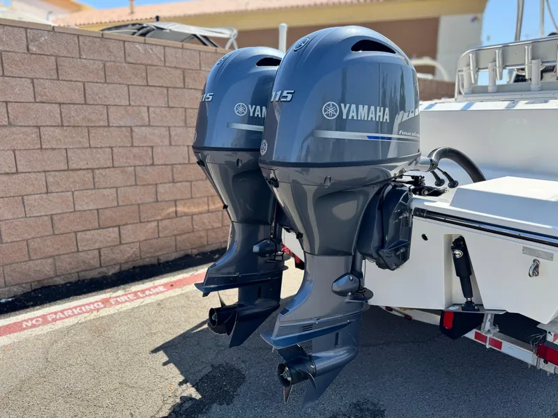 Slide: The Image of Twin Yamaha outboard engines on a 2017 Cobia 237 Center Console boat. - 6