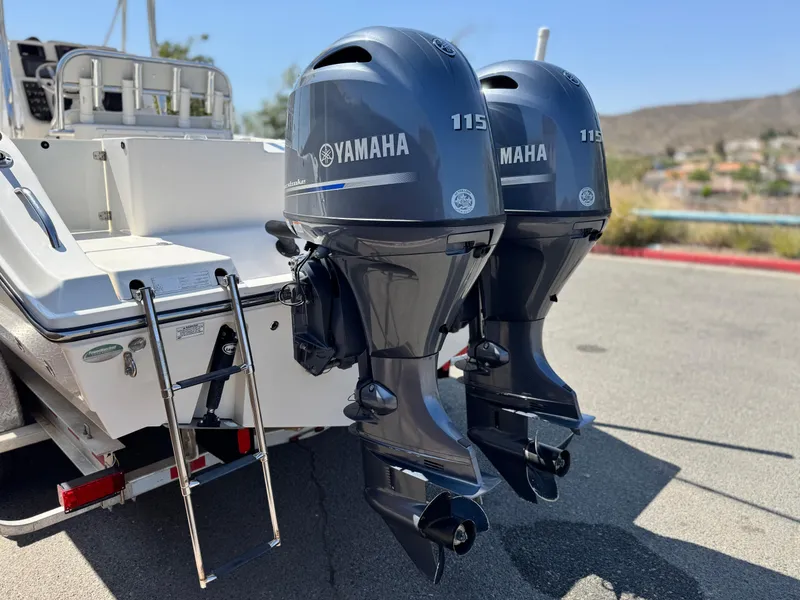 Slide: The Image of 2017 Cobia 237 Center Console with twin Yamaha 115 outboard engines. - 7