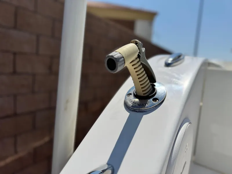 Slide: The Image of Close-up of a 2017 Cobia 237 Center Console boat throttle lever. - 9