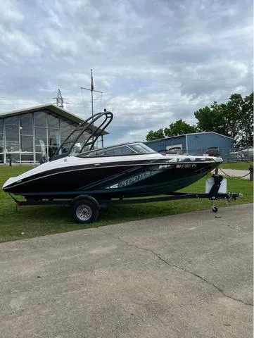 Slide: The Image of 2021 Yamaha AR195 boat on water, featuring sleek design and spacious seating. - 1