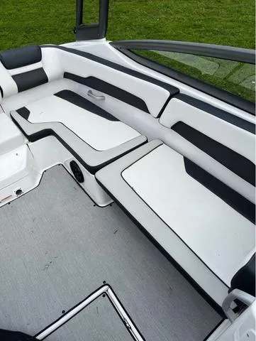Slide: The Image of 2021 Yamaha AR195 boat with passengers enjoying a ride on the water. - 6