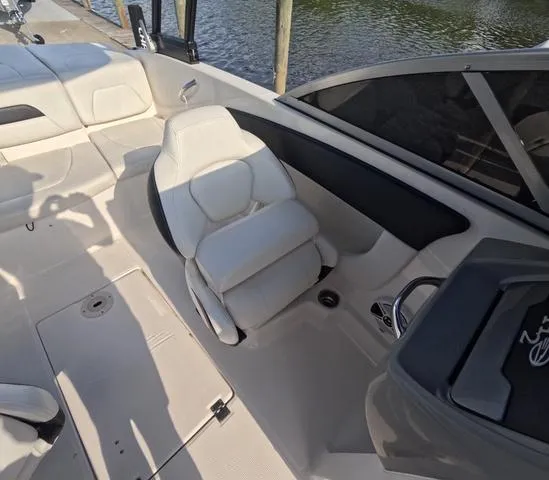 Slide: The Image of 2016 Chaparral 19 H2O Sport boat interior with white seating and dashboard. - 13