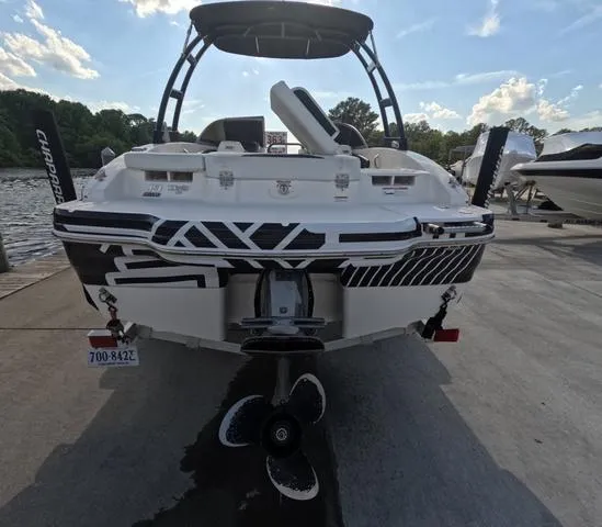 Slide: The Image of 2016 Chaparral 19 H2O Sport boat at dock, rear view, sunny day. - 3