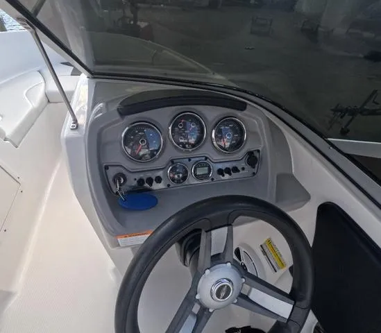 Slide: The Image of 2016 Chaparral 19 H2O Sport dashboard with steering wheel and gauges. - 7
