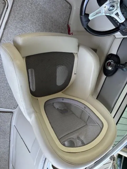 Slide: The Image of 2010 Sea Ray 260 Sundeck boat seat and steering wheel detail. - 12