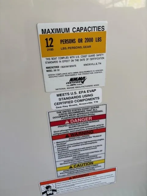 Slide: The Image of Capacity and safety label on 2010 Sea Ray 260 Sundeck boat. - 15