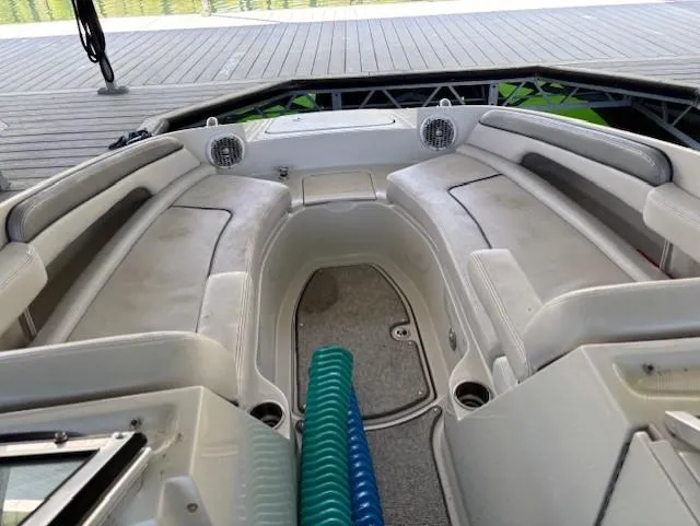 Slide: The Image of Interior of 2010 Sea Ray 260 Sundeck boat with spacious seating and speakers. - 16