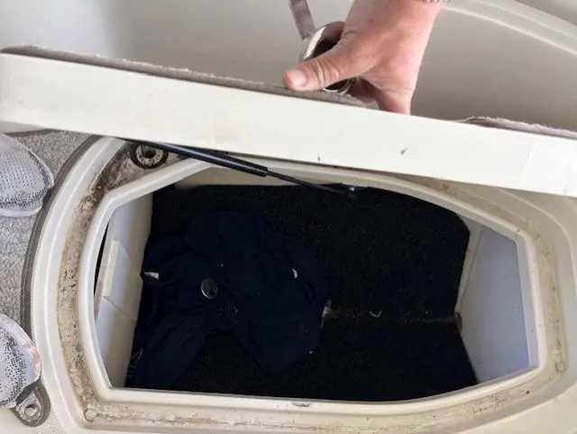 Slide: The Image of Open storage compartment on a 2010 Sea Ray 260 Sundeck boat. - 17