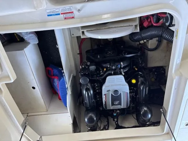 Slide: The Image of Engine compartment of a 2010 Sea Ray 260 Sundeck boat, showcasing the engine and components. - 20