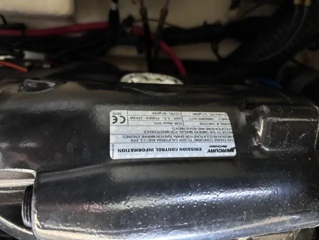 Slide: The Image of Mercury engine component with emission control label on a 2010 Sea Ray 260 Sundeck. - 21