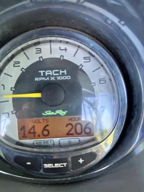 Slide: The Image of Tachometer of 2010 Sea Ray 260 Sundeck showing 14.6 volts and 206 hours. - 24