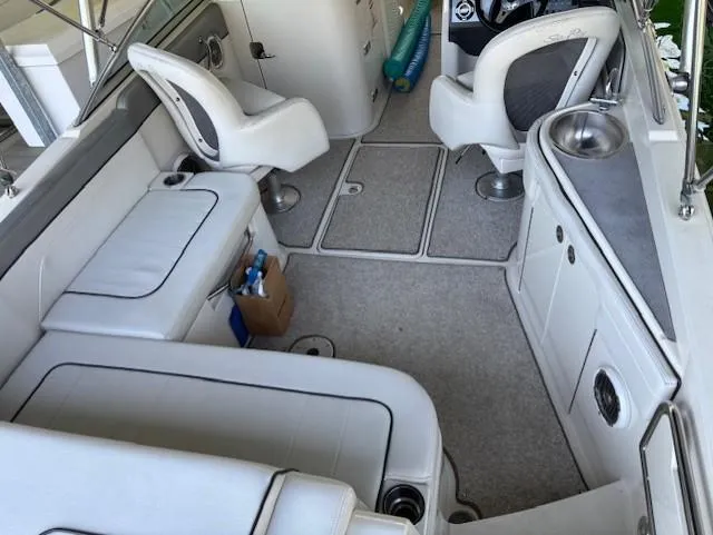Slide: The Image of Interior of a 2010 Sea Ray 260 Sundeck boat with seating and helm. - 6