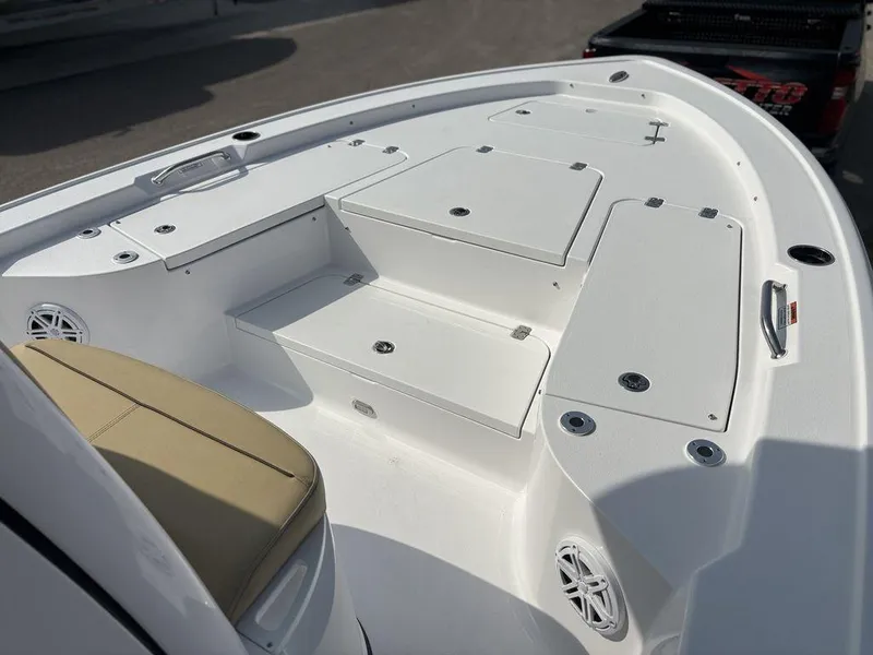 Slide: The Image of 2025 Sportsman Masters 227 boat deck with storage compartments and seating. - 13