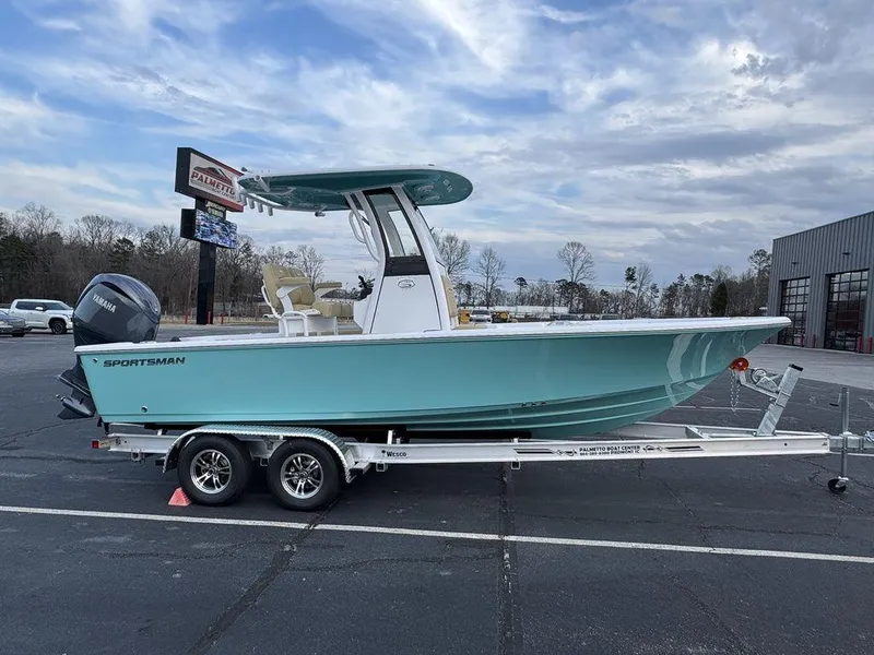 Slide: The Image of 2025 Sportsman Masters 227 boat on trailer, parked outdoors under cloudy sky. - 3